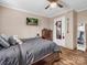 Cozy bedroom with wood floor and a full bed, dresser, and mirror at 3717 Elliott Cemetary Rd, Shelby, NC 28150