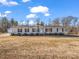 Single-story home with attached garage and spacious yard at 3717 Elliott Cemetary Rd, Shelby, NC 28150