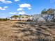 Back of house with detached garage and large yard at 3717 Elliott Cemetary Rd, Shelby, NC 28150