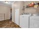 Laundry room with washer, dryer, and storage shelves at 3717 Elliott Cemetary Rd, Shelby, NC 28150