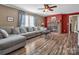 Living room with fireplace, sectional sofa and ceiling fan at 3717 Elliott Cemetary Rd, Shelby, NC 28150