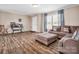 Spacious living room featuring a sectional sofa and wood-look floors at 3717 Elliott Cemetary Rd, Shelby, NC 28150