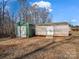 Green metal shed and wooden storage shed in yard at 3717 Elliott Cemetary Rd, Shelby, NC 28150