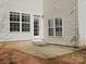 Backyard patio with white siding and a door to the house at 3865 Parkers Ferry Rd, Fort Mill, SC 29715