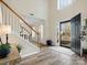 Bright foyer with hardwood floors, staircase, and natural light streaming through the front door at 3865 Parkers Ferry Rd, Fort Mill, SC 29715