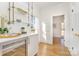 Wet bar with glass shelving and wine cooler at 3935 Black Sycamore Dr, Charlotte, NC 28226