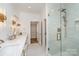 Bathroom with double vanity, marble countertop and glass shower at 3935 Black Sycamore Dr, Charlotte, NC 28226