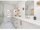 Elegant bathroom with double vanity, marble counters, and gold fixtures at 3935 Black Sycamore Dr, Charlotte, NC 28226