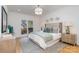 Spacious bedroom with light green bedding and wood floors at 3935 Black Sycamore Dr, Charlotte, NC 28226