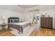 Charming bedroom with a gray bedspread and hardwood floors at 3935 Black Sycamore Dr, Charlotte, NC 28226