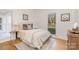 Bright bedroom featuring a plush bed and hardwood floors at 3935 Black Sycamore Dr, Charlotte, NC 28226