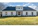 Stunning white brick home with a charming front porch and manicured lawn at 3935 Black Sycamore Dr, Charlotte, NC 28226