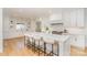 Spacious kitchen with white cabinets, marble countertops, and island at 3935 Black Sycamore Dr, Charlotte, NC 28226