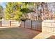 Backyard with wooden privacy fence and grass at 4152 Broadstairs Sw Dr, Concord, NC 28025