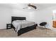 Cozy bedroom with a queen bed and ceiling fan at 4152 Broadstairs Sw Dr, Concord, NC 28025