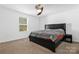 Serene bedroom with a queen bed and ceiling fan at 4152 Broadstairs Sw Dr, Concord, NC 28025