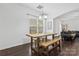 Dining area with wooden table and bench near living room at 4152 Broadstairs Sw Dr, Concord, NC 28025