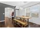 Dining area with wooden table and bench near kitchen at 4152 Broadstairs Sw Dr, Concord, NC 28025