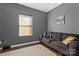 Small living room with grey walls and dark couch at 4152 Broadstairs Sw Dr, Concord, NC 28025