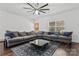 Spacious living room with L-shaped sofa and hardwood floors at 4152 Broadstairs Sw Dr, Concord, NC 28025