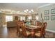 Open dining room with hardwood floors and a view of the living room at 417 Spring Arbor Ave, Salisbury, NC 28146