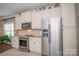 Kitchen features stainless steel appliances and light colored cabinets at 417 Spring Arbor Ave, Salisbury, NC 28146