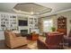 Spacious living room with built-in shelving, fireplace, and hardwood floors at 417 Spring Arbor Ave, Salisbury, NC 28146