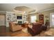 Spacious living room with built-in shelving, fireplace, and hardwood floors at 417 Spring Arbor Ave, Salisbury, NC 28146