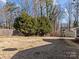 Large backyard with mature trees and chain link fence at 4532 Oakwood Cir, Gastonia, NC 28056