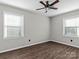 Bedroom with hardwood floors, neutral walls, and ceiling fan at 4532 Oakwood Cir, Gastonia, NC 28056