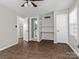 Bedroom with hardwood floors, ceiling fan, and built-in shelving at 4532 Oakwood Cir, Gastonia, NC 28056