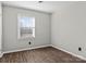 Simple bedroom with wood-look flooring and window blinds at 4532 Oakwood Cir, Gastonia, NC 28056