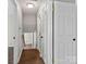 Clean hallway with wood flooring leading to upstairs at 4532 Oakwood Cir, Gastonia, NC 28056