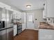 Modern kitchen with white cabinets and stainless steel appliances at 4532 Oakwood Cir, Gastonia, NC 28056