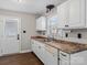 White kitchen with stainless steel appliances and flooring at 4532 Oakwood Cir, Gastonia, NC 28056