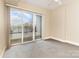 Bedroom with sliding door to balcony and city views at 4620 Piedmont Row Dr # 318D, Charlotte, NC 28210