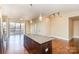 Open kitchen with granite island and stainless steel appliances at 4620 Piedmont Row Dr # 318D, Charlotte, NC 28210