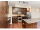 Modern kitchen with granite countertops and stainless steel appliances at 4620 Piedmont Row Dr # 318D, Charlotte, NC 28210