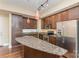 Modern kitchen with granite countertops and stainless steel appliances at 4620 Piedmont Row Dr # 318D, Charlotte, NC 28210