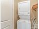 Stackable washer and dryer in a convenient laundry closet at 4620 Piedmont Row Dr # 318D, Charlotte, NC 28210