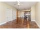 Open living room with hardwood floors and kitchen island at 4620 Piedmont Row Dr # 318D, Charlotte, NC 28210