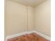 Empty room with hardwood floors and neutral walls at 4620 Piedmont Row Dr # 318D, Charlotte, NC 28210