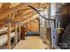 Unfinished attic space with HVAC systems and storage area at 4855 Star Hill Ln, Charlotte, NC 28214