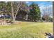 Spacious backyard with lush lawn and mature trees at 4855 Star Hill Ln, Charlotte, NC 28214