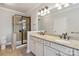 Double vanity bathroom with a large shower and granite countertop at 4855 Star Hill Ln, Charlotte, NC 28214