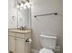 Small bathroom with granite vanity and toilet at 4855 Star Hill Ln, Charlotte, NC 28214