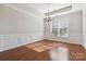 Formal dining room with hardwood floors and wainscoting at 4855 Star Hill Ln, Charlotte, NC 28214