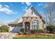 Brick home with a two-car garage and landscaped front yard at 4855 Star Hill Ln, Charlotte, NC 28214