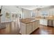 Open kitchen with island, granite countertops, and stainless steel appliances at 4855 Star Hill Ln, Charlotte, NC 28214