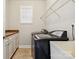 Laundry room with washer, dryer, and built-in cabinets at 4855 Star Hill Ln, Charlotte, NC 28214